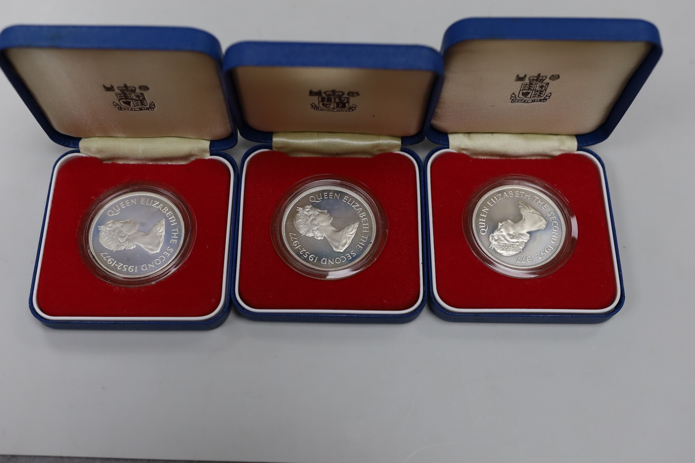 Eleven Royal Mint Commonwealth commemorative proof silver crowns